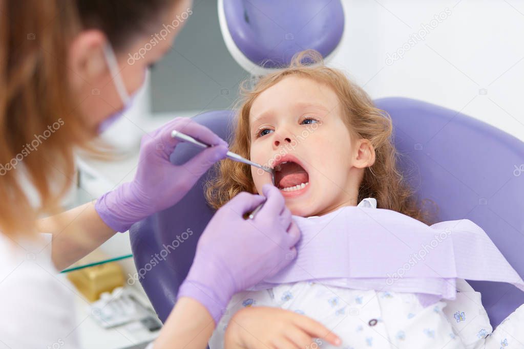 Pediatric dentist with patient