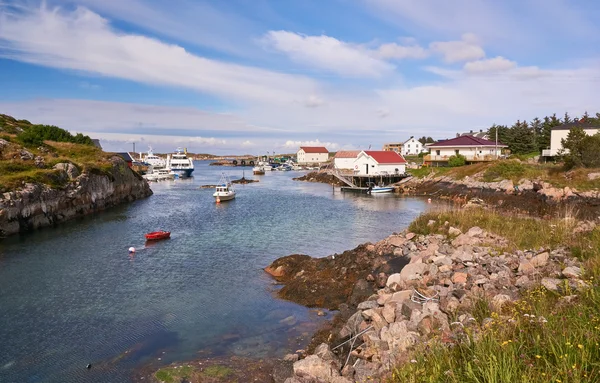 Fjord surrounded by buildings, boats moored — Stock Photo, Image