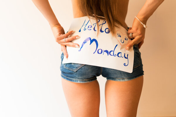 woman holding sign hello Monday