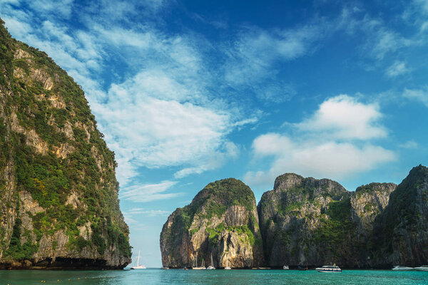 Maya Bay, huge cliffs in tropical sunny lagoon
