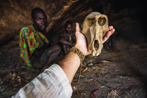 Eyasi lake, Tanzania, november, 23, 2019: Hand showing a skull of animal Royalty Free Stock Photos