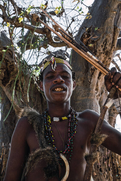 Eyasi lake, Tanzania, november, 23, 2019: African hunter with jewels and ornamentstana Stock Photo