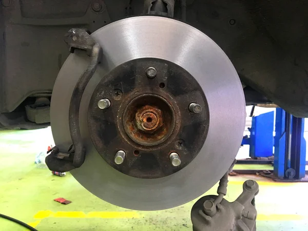 Disk break repair in the service car ,Disk break repair on the white backgroud
