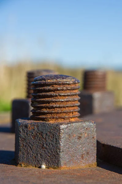 Close Rusty Brown Bolts Background Blue Sky — Stock Photo, Image