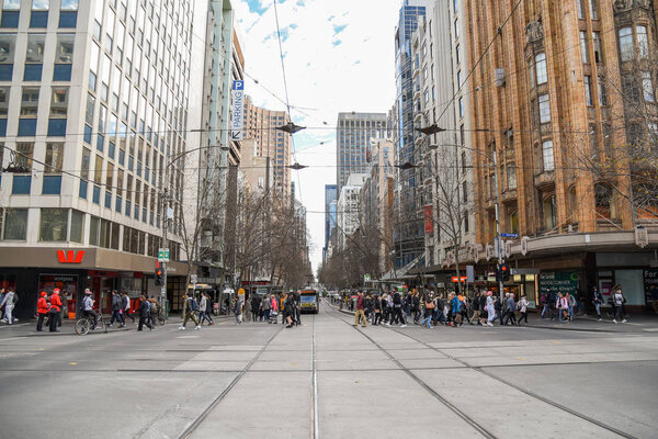 MELBOURNE, AUSTRALIA - JULY 18, 2016 : Unidentified people walk in Melbourne city, Victoria, Australia.