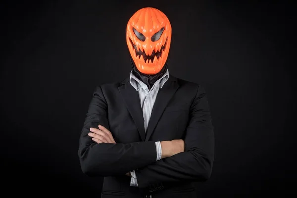 Halloween zakenman met pompoen masker — Stockfoto