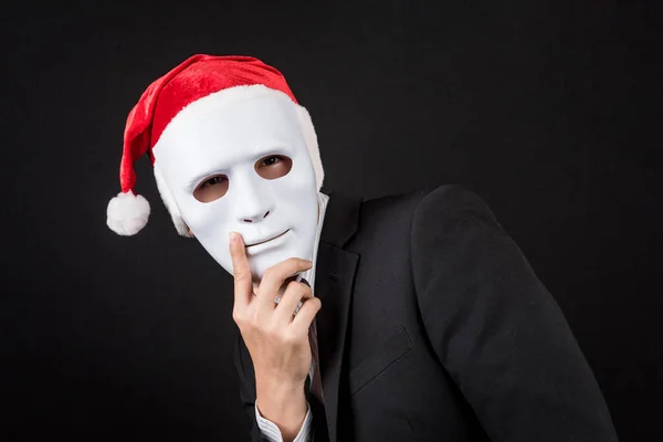 Junger asiatischer Geschäftsmann mit weißer Maske und Weihnachtsmütze — Stockfoto