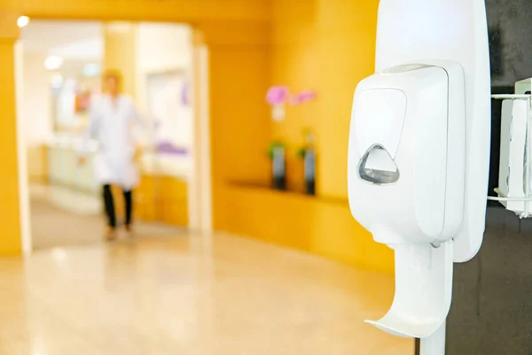 Automatic alcohol dispenser in hospital — Stock Photo, Image