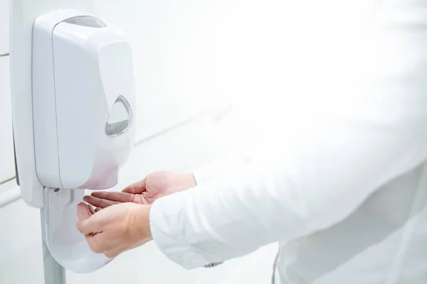 Automatic alcohol dispenser in hospital — Stock Photo, Image