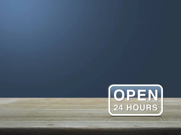 Open 24 hours icon on wooden table over light blue gradient back — Stock Photo, Image