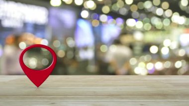 Harita nokta konum düğmesi ahşap masa üzerinde bulanık ışık ve alışveriş merkezinin gölgesi, harita işaretleyici navigasyon konsepti