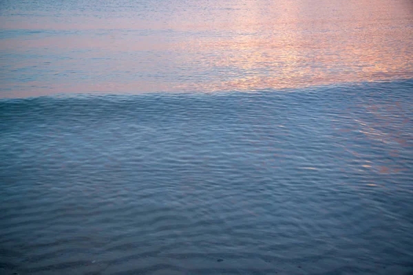 Tekstur gelombang saat matahari terbenam — Stok Foto