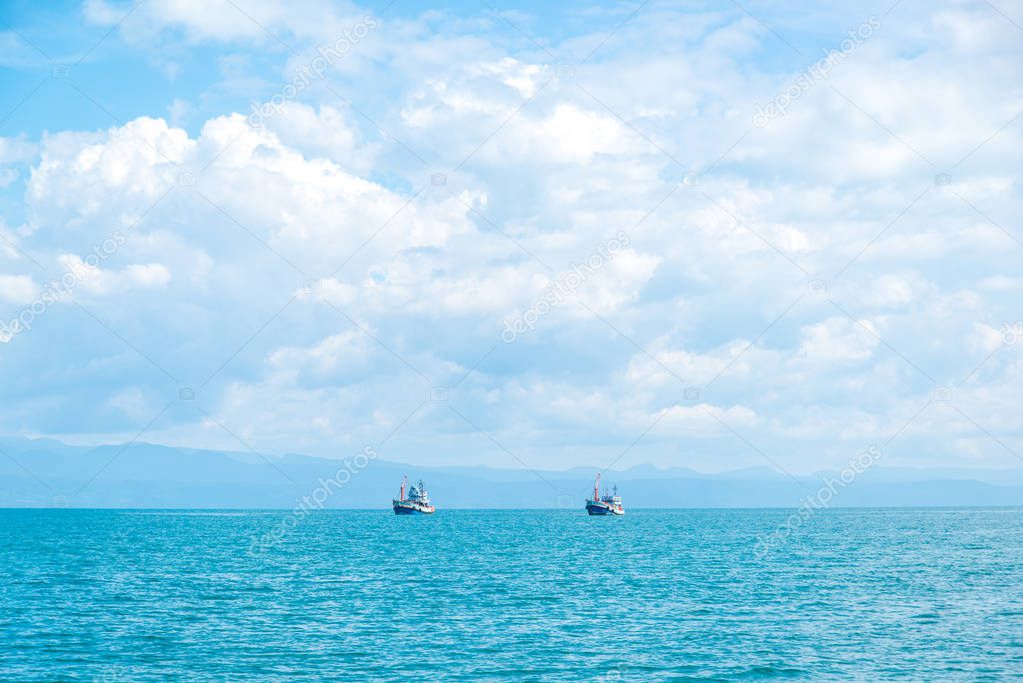 couple boats in the blue sea 