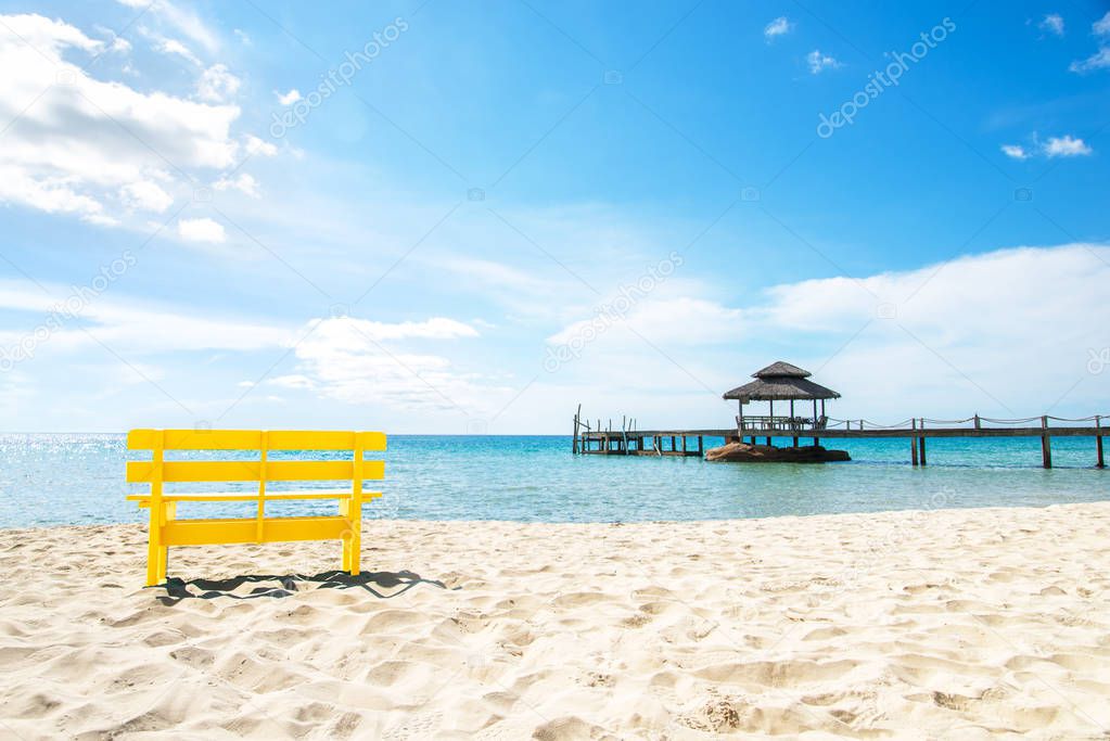 Yellow chair and blue sky  at sea, Complimentary color