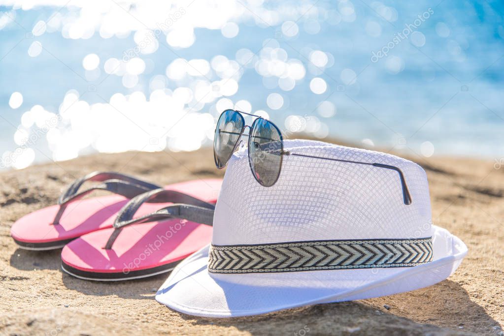 Accessories for vacation on sand at beach, sun protection on sum