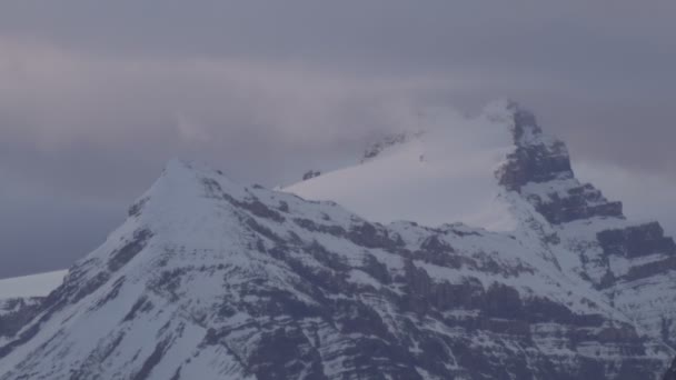 Close up view of snow topped mountain in the Canadian Rockies. — Stock Video