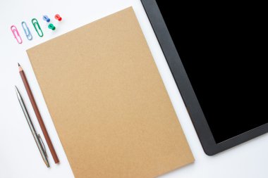 blank notepad with pen and pencil on a white background