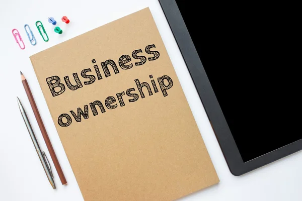 Text business ownership on brown paper book on table / business concept