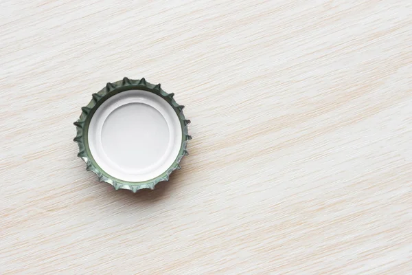 top view of a glass of beer on a wooden background