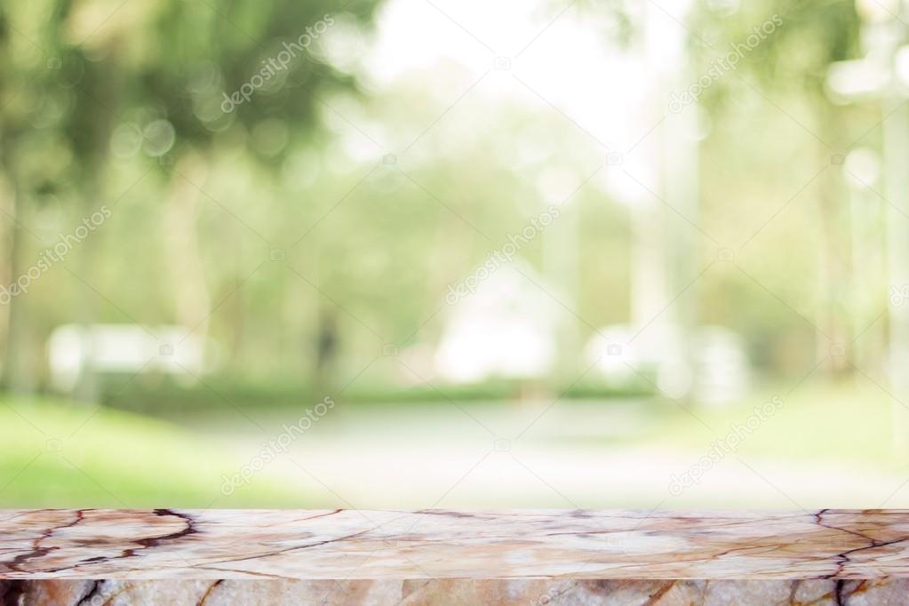 White marble stone countertop or table on backdrop blurred nature background  / for display or montage your products / empty marble background concept  Stock Photo by ©ooddysmile 125255356