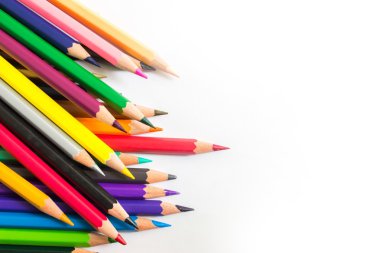 colored pencils on background of a paper