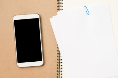 top view of a notebook with a blank screen on a wooden background