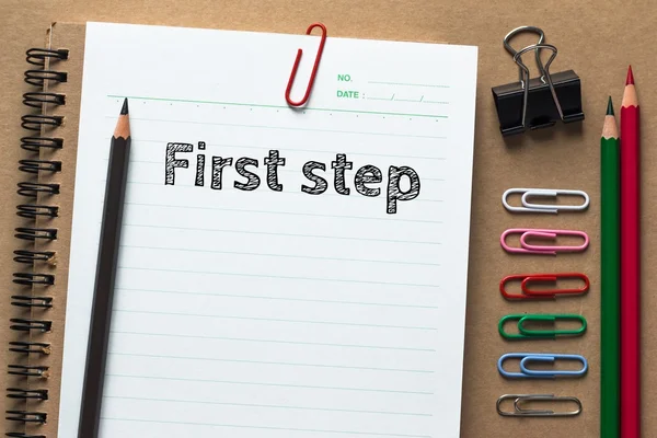 Text First step on white paper background — Stock Photo, Image