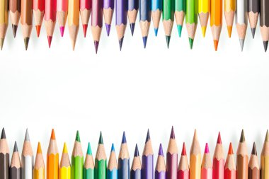 a closeup of a group of different pencils on white background