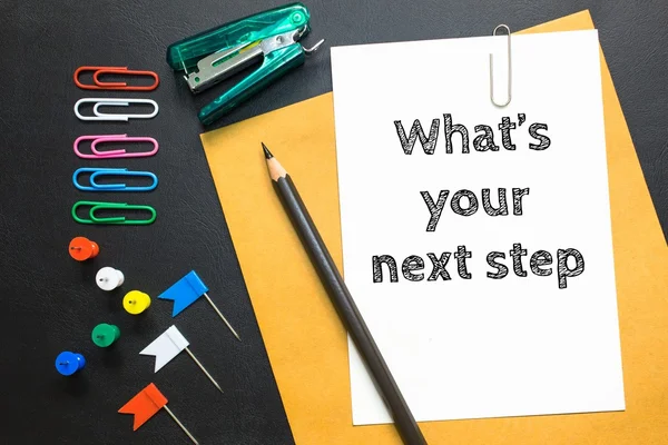 Text What's your next step on white paper background / business concept — Stock Photo, Image