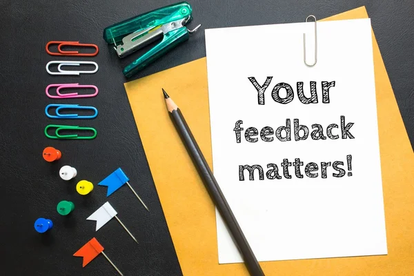 Text your feedback matters on white paper background / business concept — Stock Photo, Image