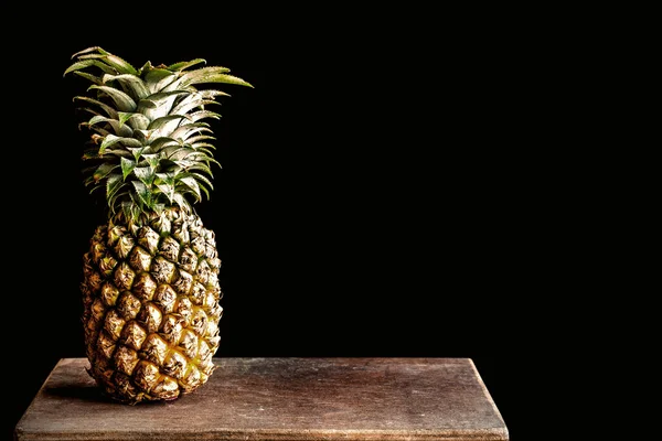 Pineapple on the old wooden — Stock Photo, Image