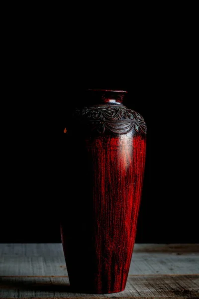 Old vase on a wooden.