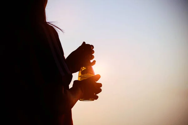 Woman with bottles water at sunset. — Stock Photo, Image