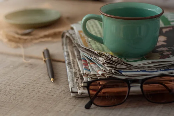 Newspapers on wooden floor. — Stock Photo, Image