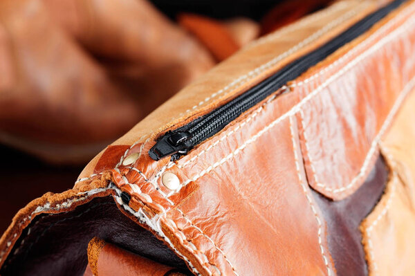 zipper on the leather bag.