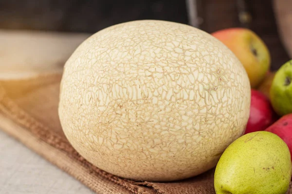 Melon on sackcloth. — Stock Photo, Image