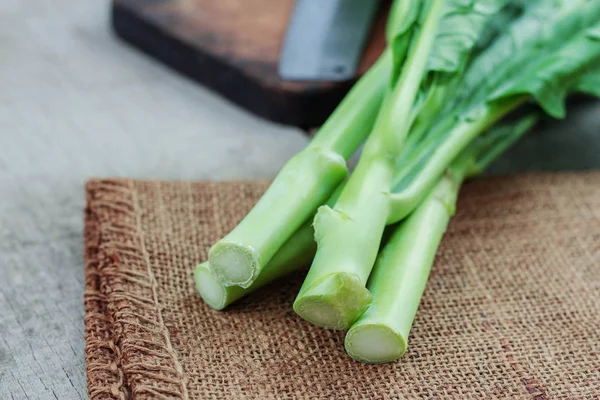 Fresh kale on sack. — Stock Photo, Image