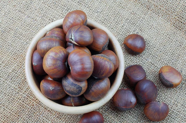 Chestnuts on sackcloth. — Stock Photo, Image