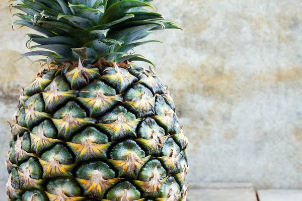 Pineapple with old wall. — Stock Photo, Image