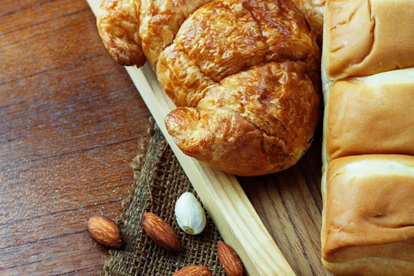 Bread on wooden background. — Stock Photo, Image