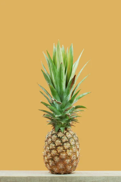 Pineapple with yellow background. — Stock Photo, Image