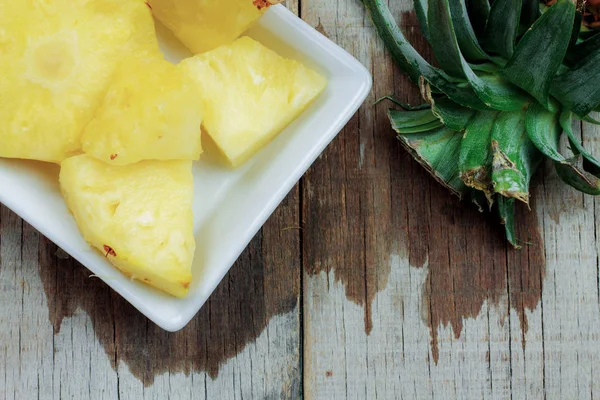 Pineapple slices on dish.