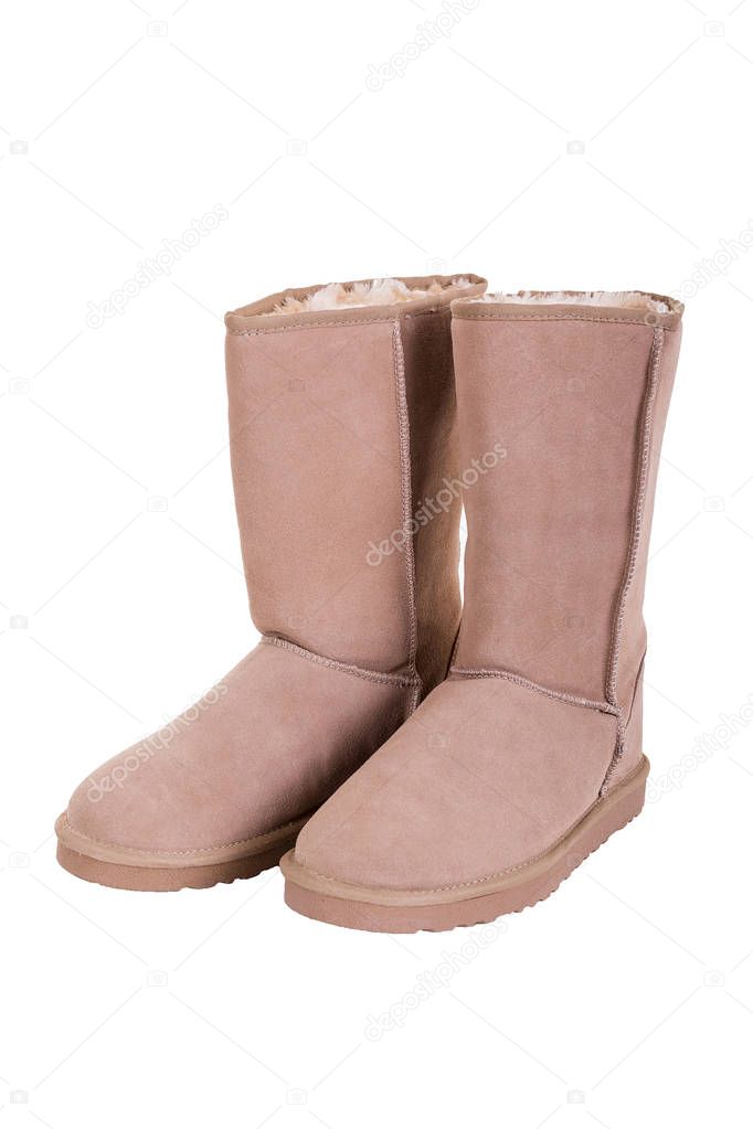 Fashion winter ugg boots of sheepskin isolated on white backgrou