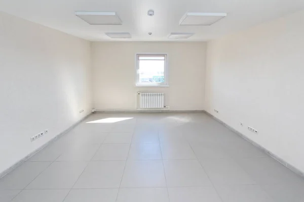 Interior empty office light room with white wallpaper unfurnished in a new building