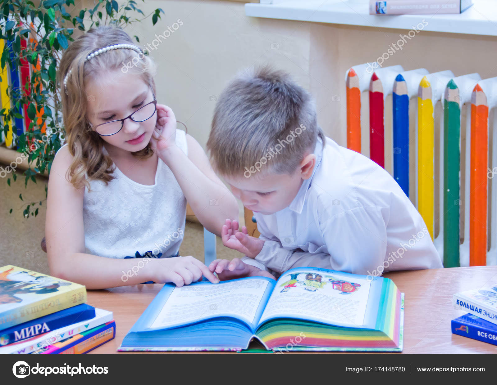 Two Small Schoolchildren Boy Girl Sitting Together Desk Classroom