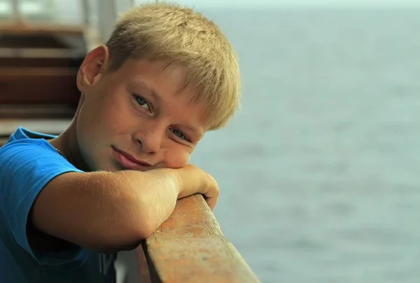 Boy is sitting on a seat in ferry — Stock Photo, Image