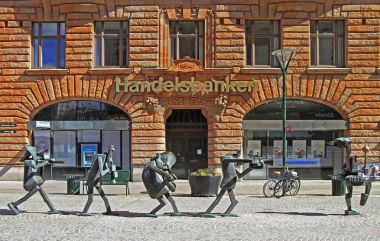 The Optimists Orchestra is sculpture at Sodergatan street in Malmo, Sweden clipart