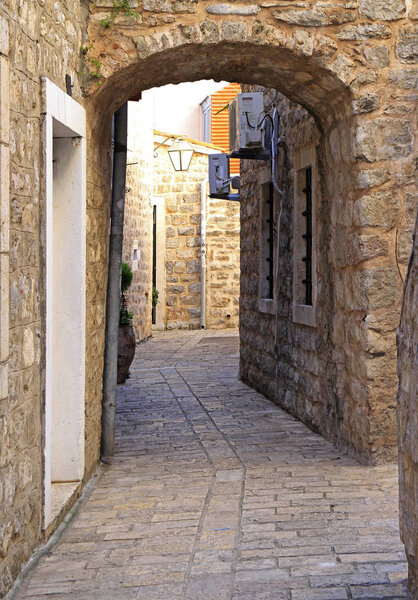Picturesque narrow street in old town of Budva, Montenegro