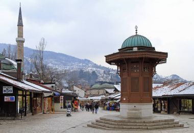 Bascarsija square with Sebilj wooden fountain in Old Town Sarajevo clipart