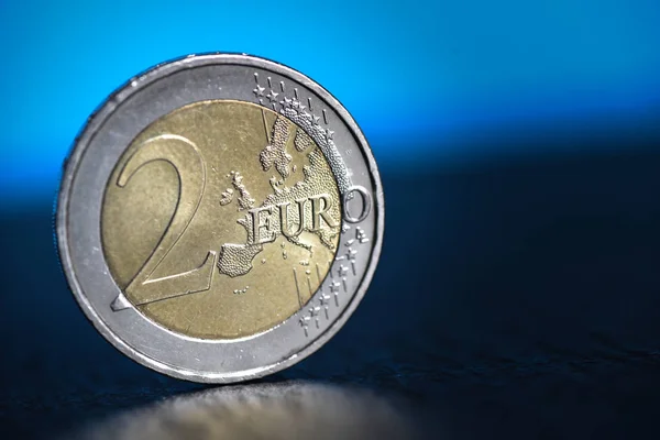 two Euro coin Finance system concept close up